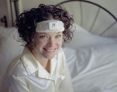 Photo wearing SleepGuard headband sitting